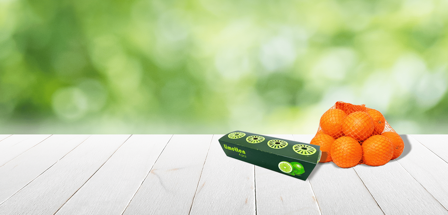 Limonen in JASA-Sleeve-Verpackung und Zitrusfrüchte im Netzbeutel, verpackt mit C-pack-Netzclipper – clevere Verpackungslösungen für Zitrusfrüchte